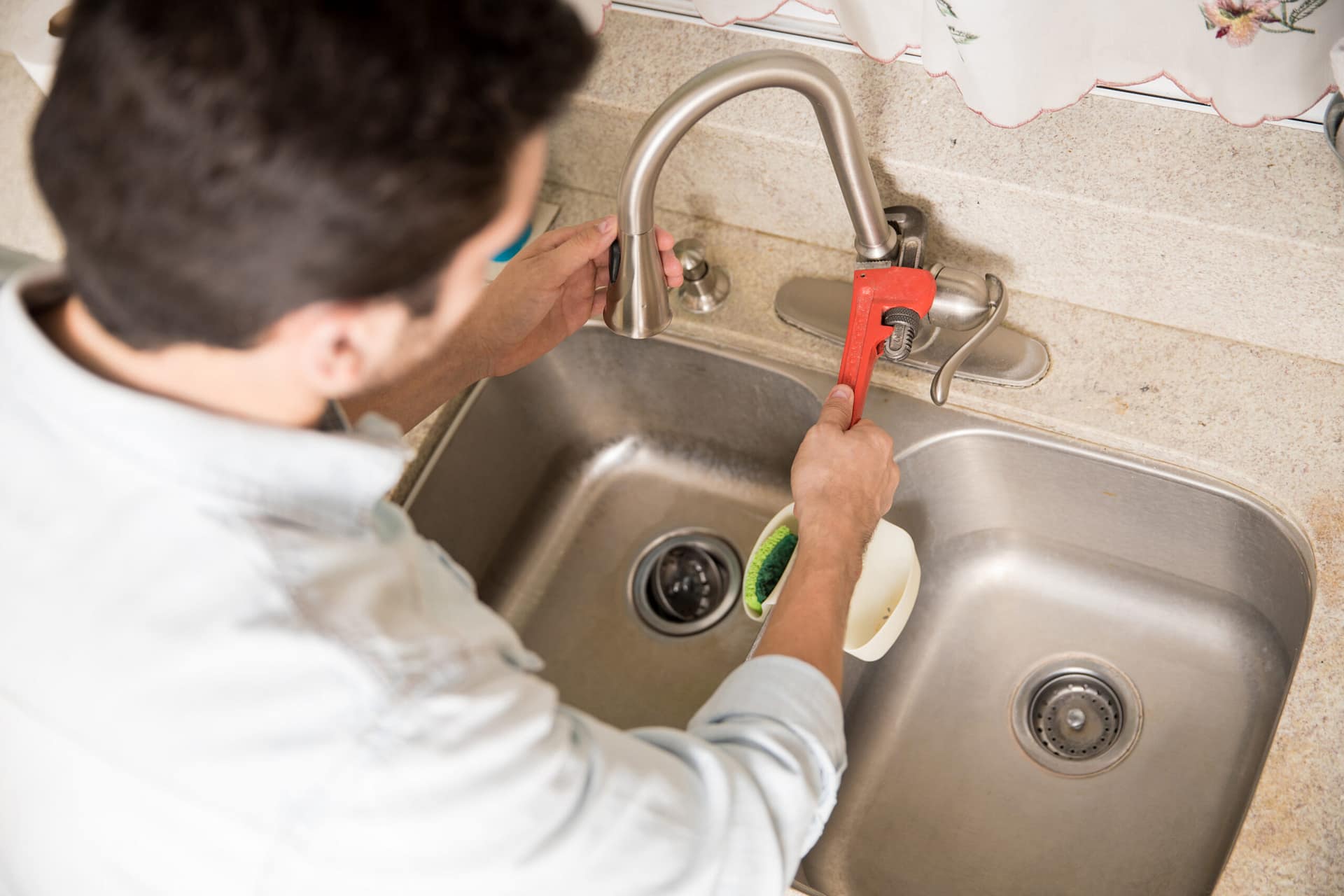 Closeup of plumber fixing a faucet Expert team providing reliable 24/7 home plumbing services near me for fast leak repairs and water system maintenance